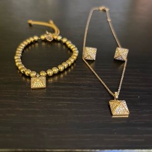 Michael Kors matching rose gold necklace, earrings and bracelet set.